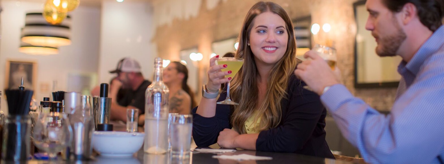 A couple sitting at a bar in Odette Florence, AL
